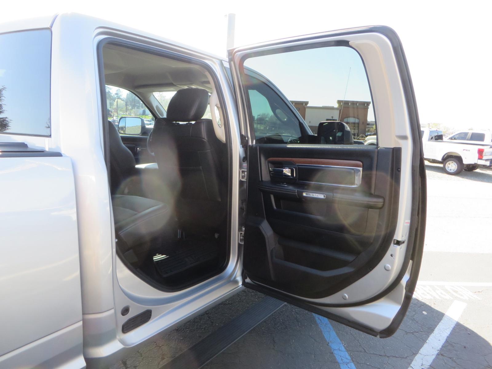 2016 SILVER /BLACK RAM 2500 Laramie Crew Cab SWB 4WD (3C6UR5FL3GG) with an 6.7L L6 OHV 24V TURBO DIESEL engine, 6A transmission, located at 2630 Grass Valley Highway, Auburn, CA, 95603, (530) 508-5100, 38.937893, -121.095482 - Leveled Ram sitting on Fuel Offroad wheels, Falken Wildpeak AT tires, Amp Power steps, Rolling Bed cover, Color matched fender flares, and window tint. - Photo #49
